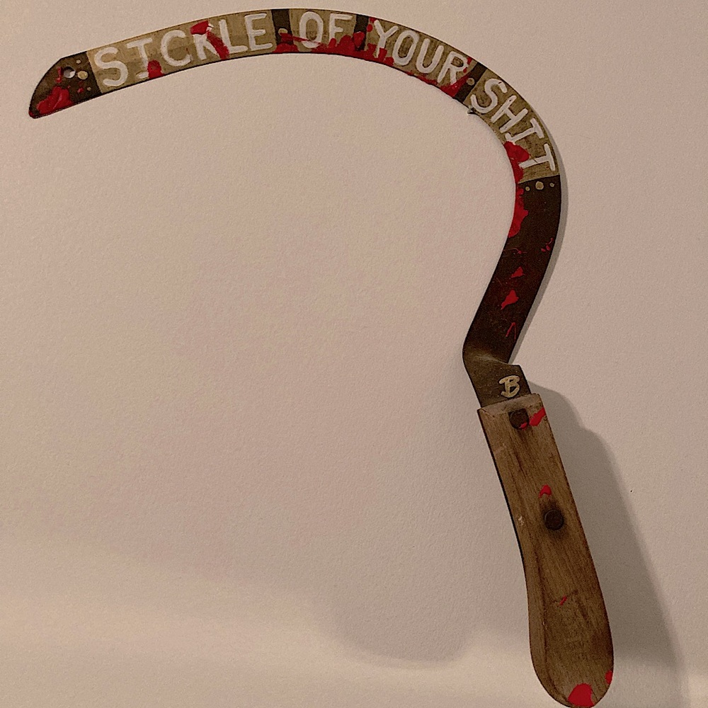Horror inspired weaponry wall art.